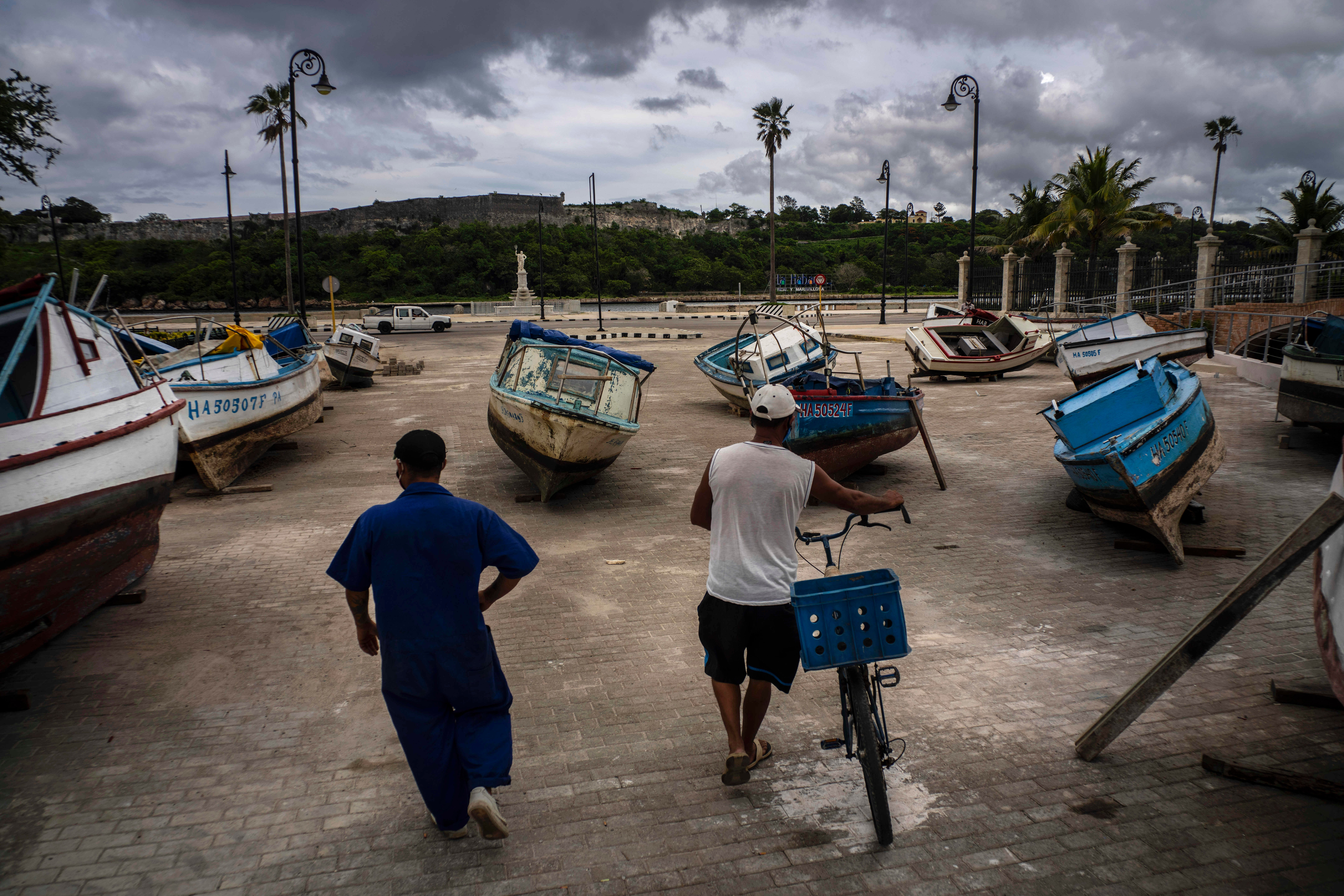 Fishermen in Havana inspect their boats after they have been taken out of the bay to avoid damage from the passage of Tropical Storm Elsa
