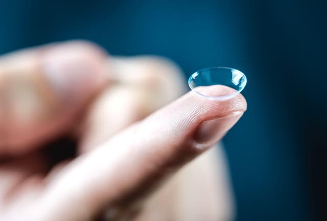 Contact lens on finger