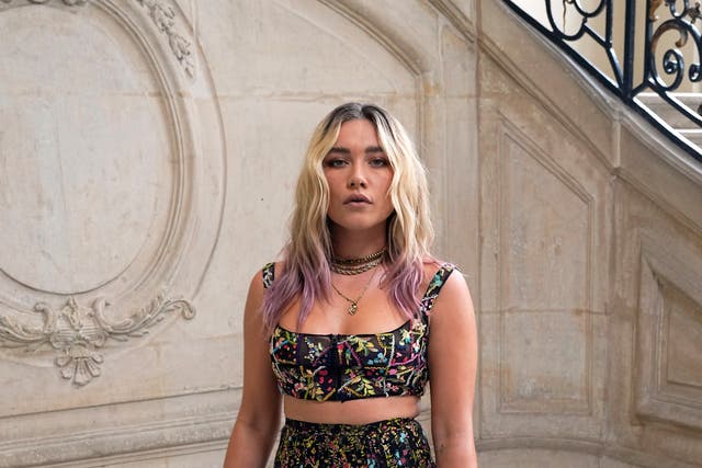 Actress Florence Pugh poses for photographers prior to the Dior's Haute Couture Fall-Winter 2021-2022 fashion collection presented Monday, July 5, 2021, in Paris