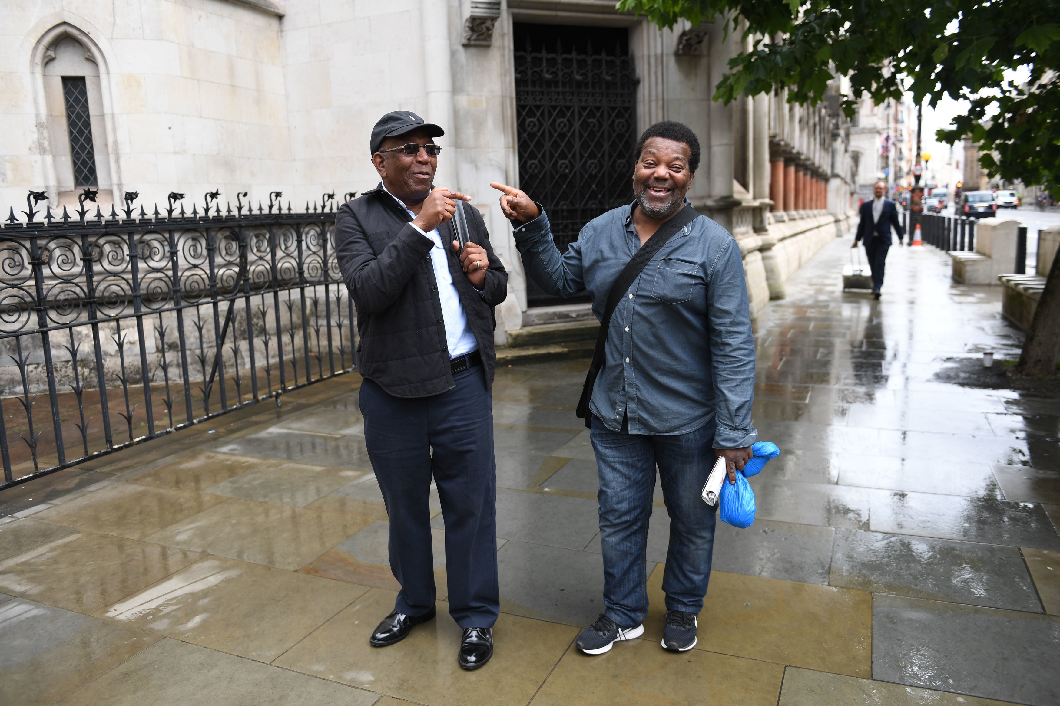 <p>Paul Green (left) and Cleveland Davidson outside the Royal Courts of Justice in London after having their convictions quashed</p>