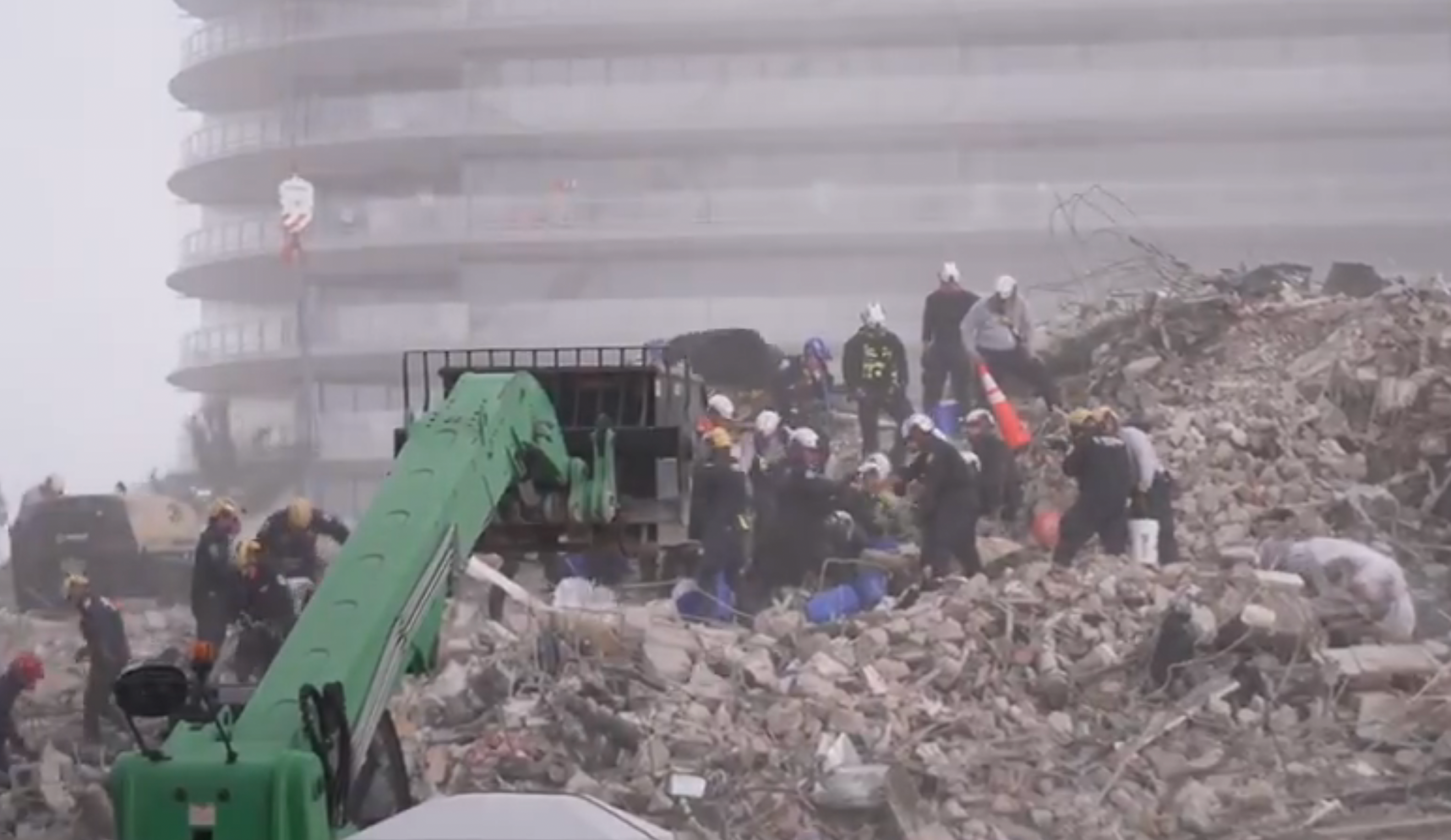 Workers are battling the elements as they attempt to find survivors