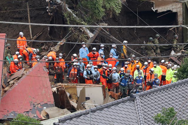 <p>Police and firefighter rescuers are searching for missing people in Atami</p>