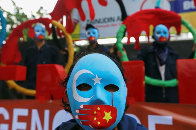 <p>Activists in Indonesia take part in protest to boycott the Beijing 2022 Winter Olympics</p>