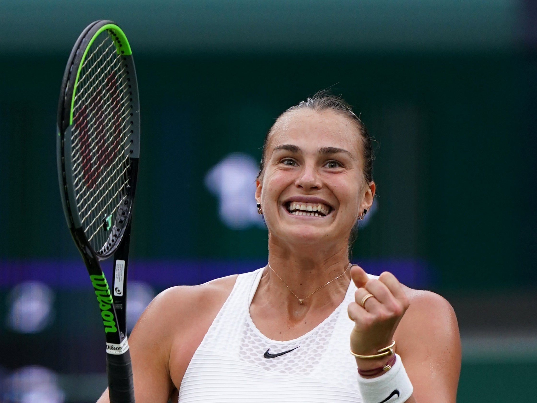 Aryna Sabalenka celebrates after beating Ons Jabeur