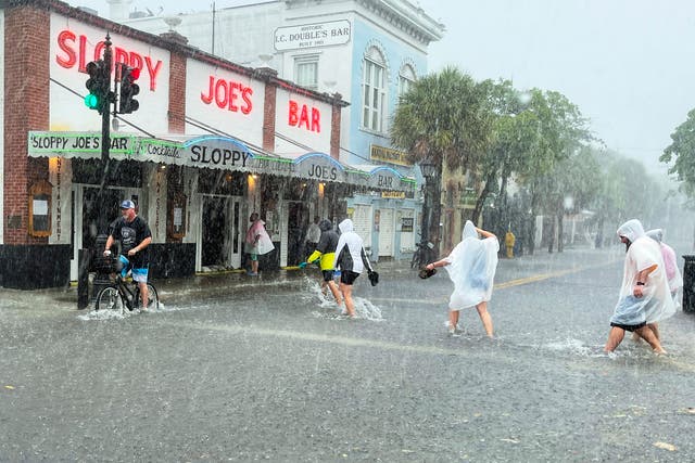 <p>Elsa has already dumped heavy rain on Key West, Florida, causing flooding on its path northwards</p>