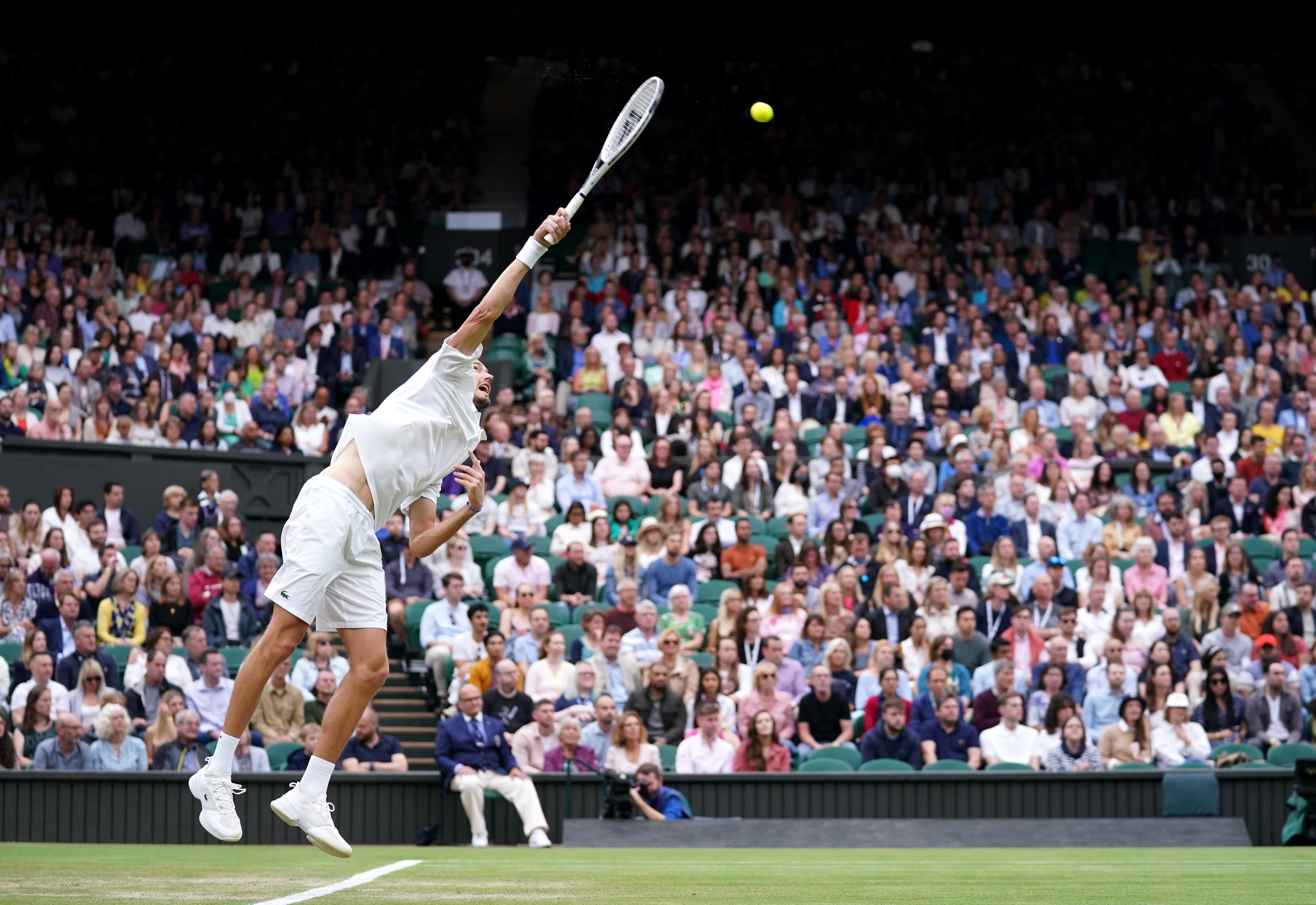 A capacity crowd was allowed into Wimbledon for the first time since the 2019 tournament but second seed Daniil Medvedev suffered a shock quarter-final defeat to Hubert Hurkacz