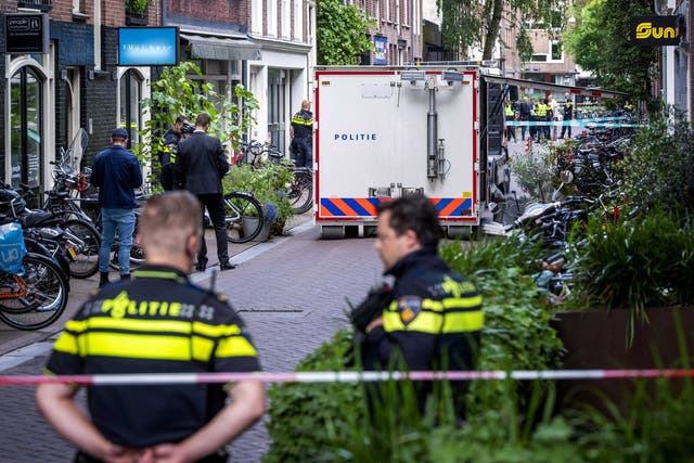<p>Police at the site of a shooting in Amsterdam, the Netherlands, 6 July 2021, where a man was seriously injured.</p>