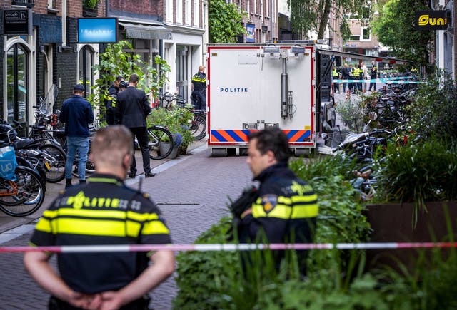 <p>Police at the site of a shooting in Amsterdam, the Netherlands, 6 July 2021, where a man was seriously injured.</p>