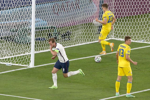 <p>Harry Kane celebrates after scoring against Ukraine</p>