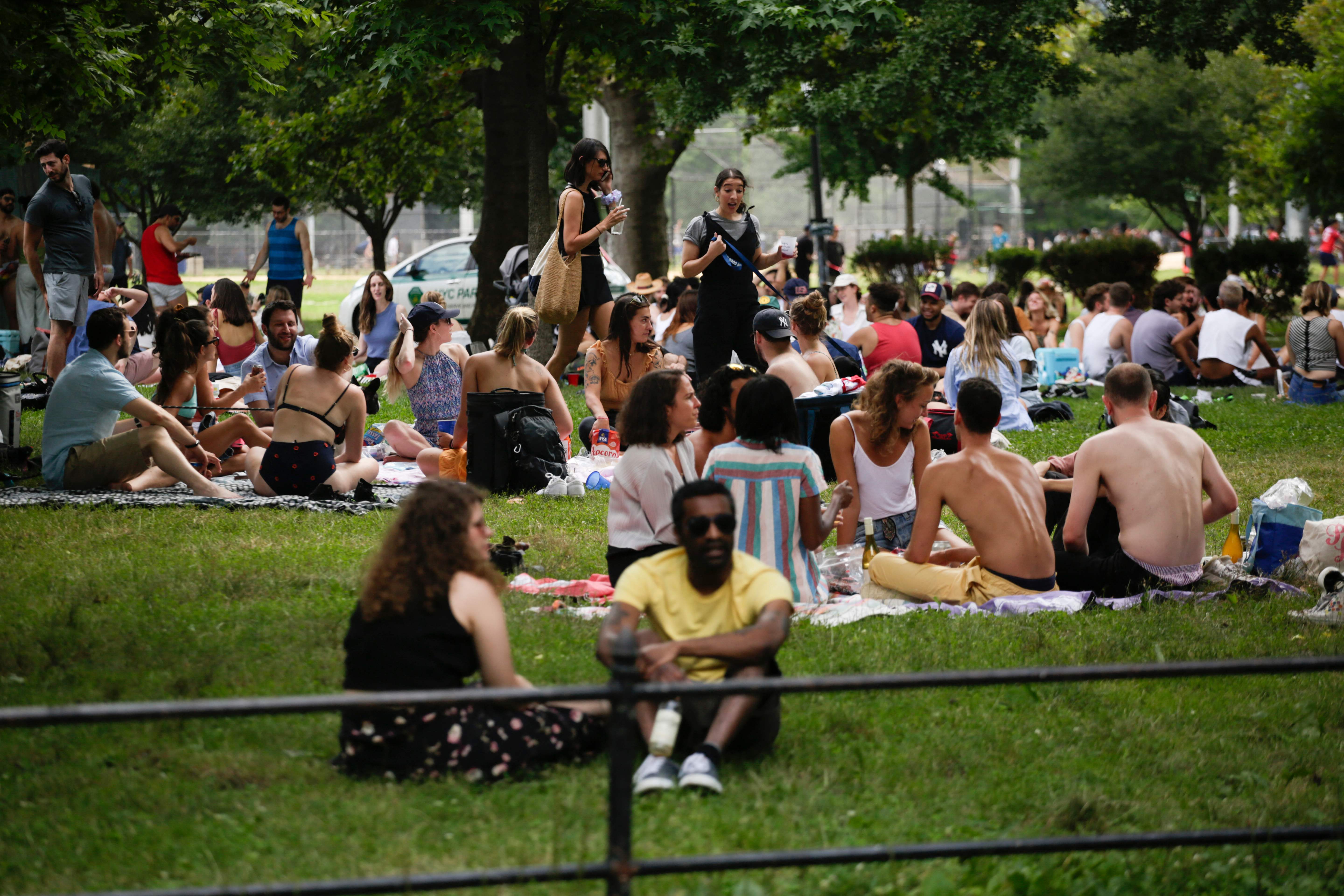 People gather in McCarren Park during the US Independence Day holiday in New York on 4 July