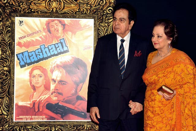 <p>Indian Bollywood film actor Dilip Kumar (L) and his wife Saira Banu pose on the red carpet at a film premiere in 2012</p>