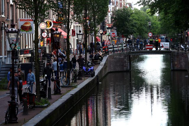 <p>Amsterdam’s Red Light District as it reopened in early July after the city’s Covid lockdown</p>