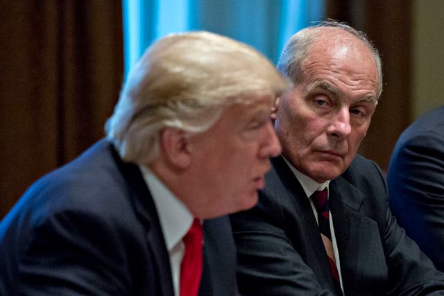 <p>Former White House chief of staff John Kelly listens as ex-US president Donald Trump speaks at a briefing with senior military leaders at the White House 5 October 2017</p>