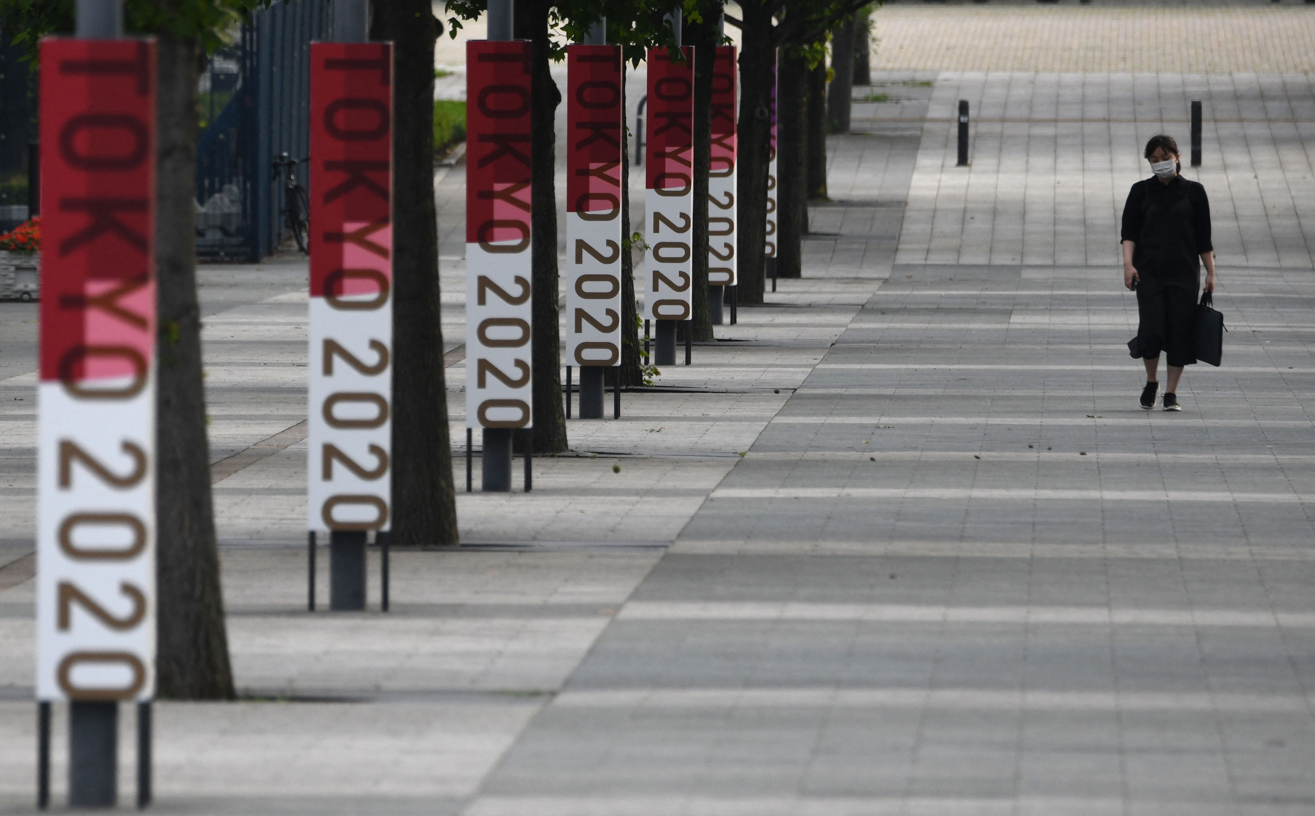 The logos of Tokyo 2020 are displayed at a street near Odaiba Seaside Park in the Japanese capital