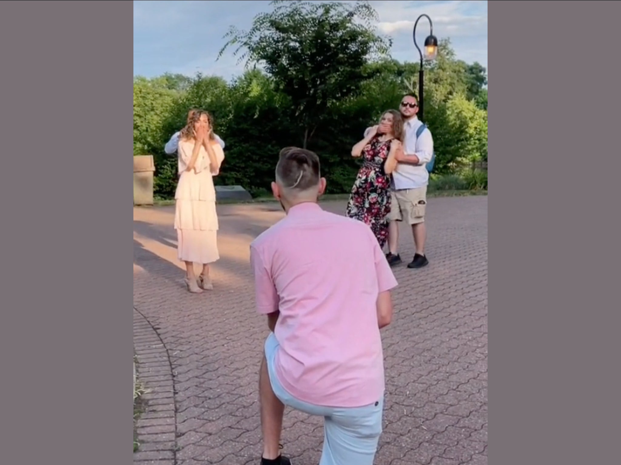 Woman dragged away from proposal so she doesn’t ruin the surprise in ...