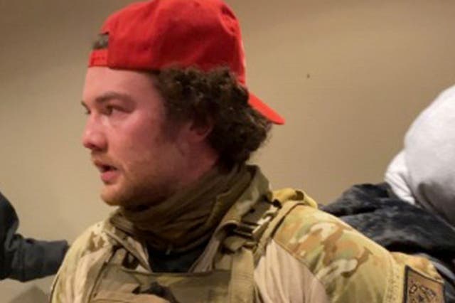 <p>Robert Morss, 27, in tactical gear and a red MAGA hat during the Capitol riot. Mr Morss has been arrested and charged for his participation in the attack. </p>