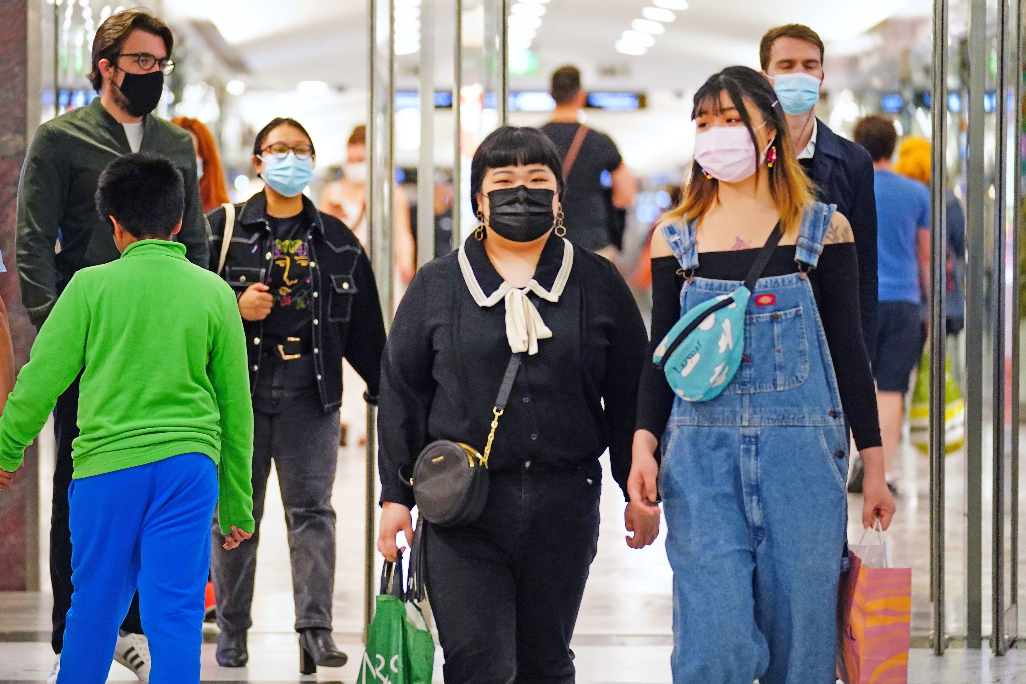 Shoppers wearing facemasks in east London on Wednesday as daily Covid cases rose to more than 32,000