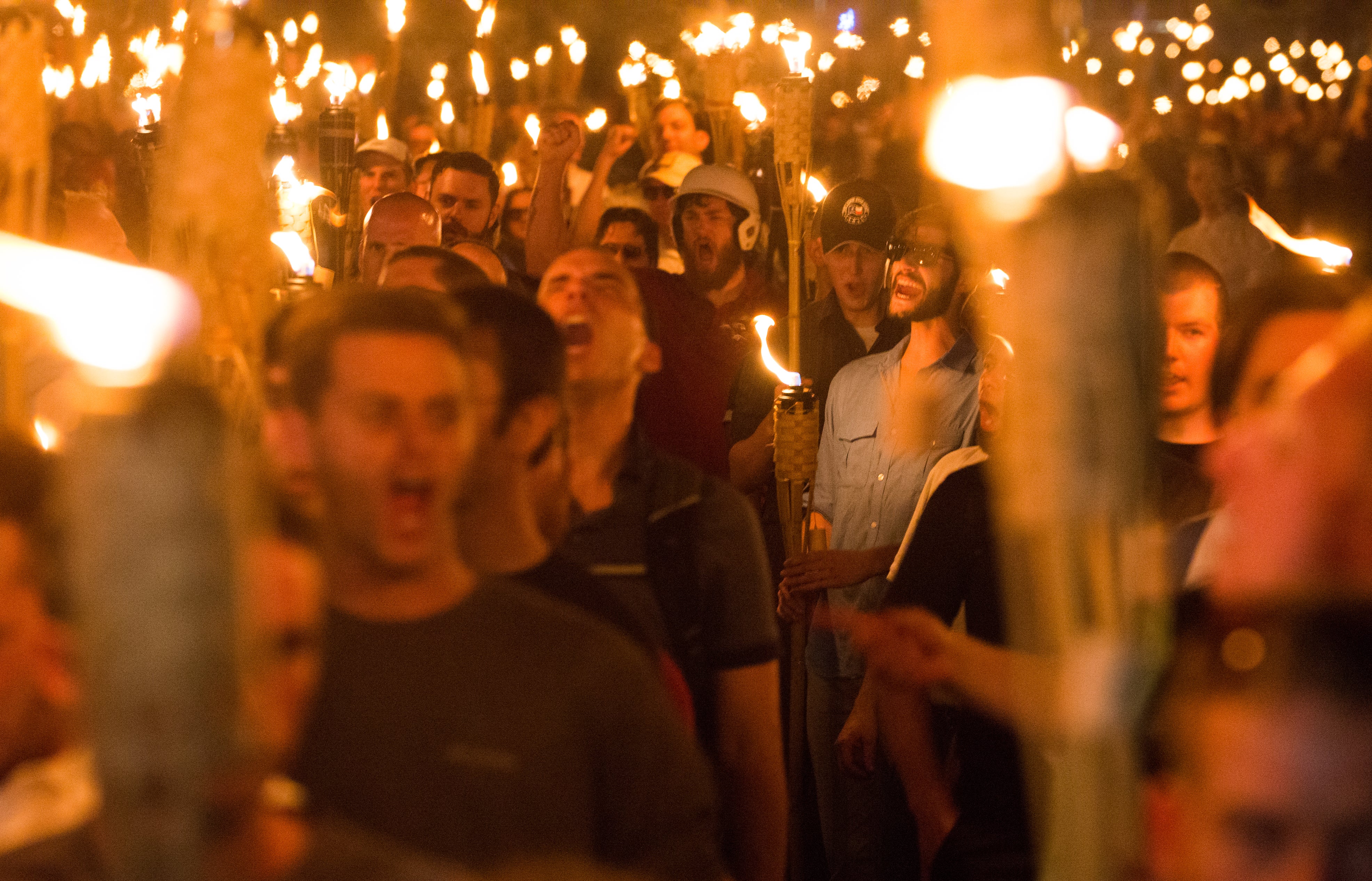 Neo Nazis, alt-right, and white supremacists march with tiki torches before the ‘Unite the Right’ rally in Charlottesville, Virginia