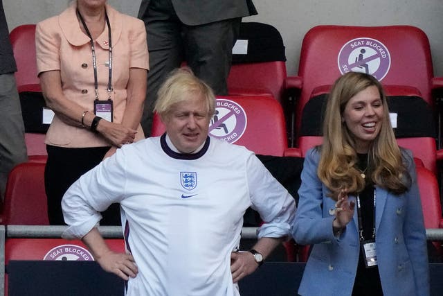 <p>Johnson and his wife Carrie at the Euro 2020 championship semi-final</p>