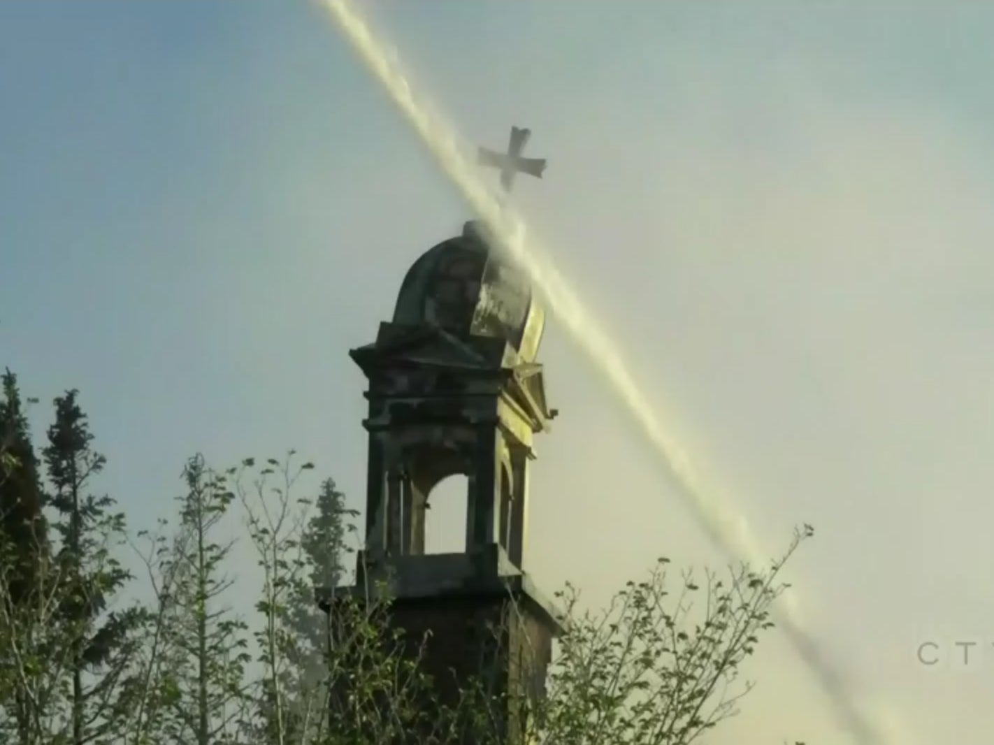 Firefighters put out a burning Catholic church in Calgary, Canada