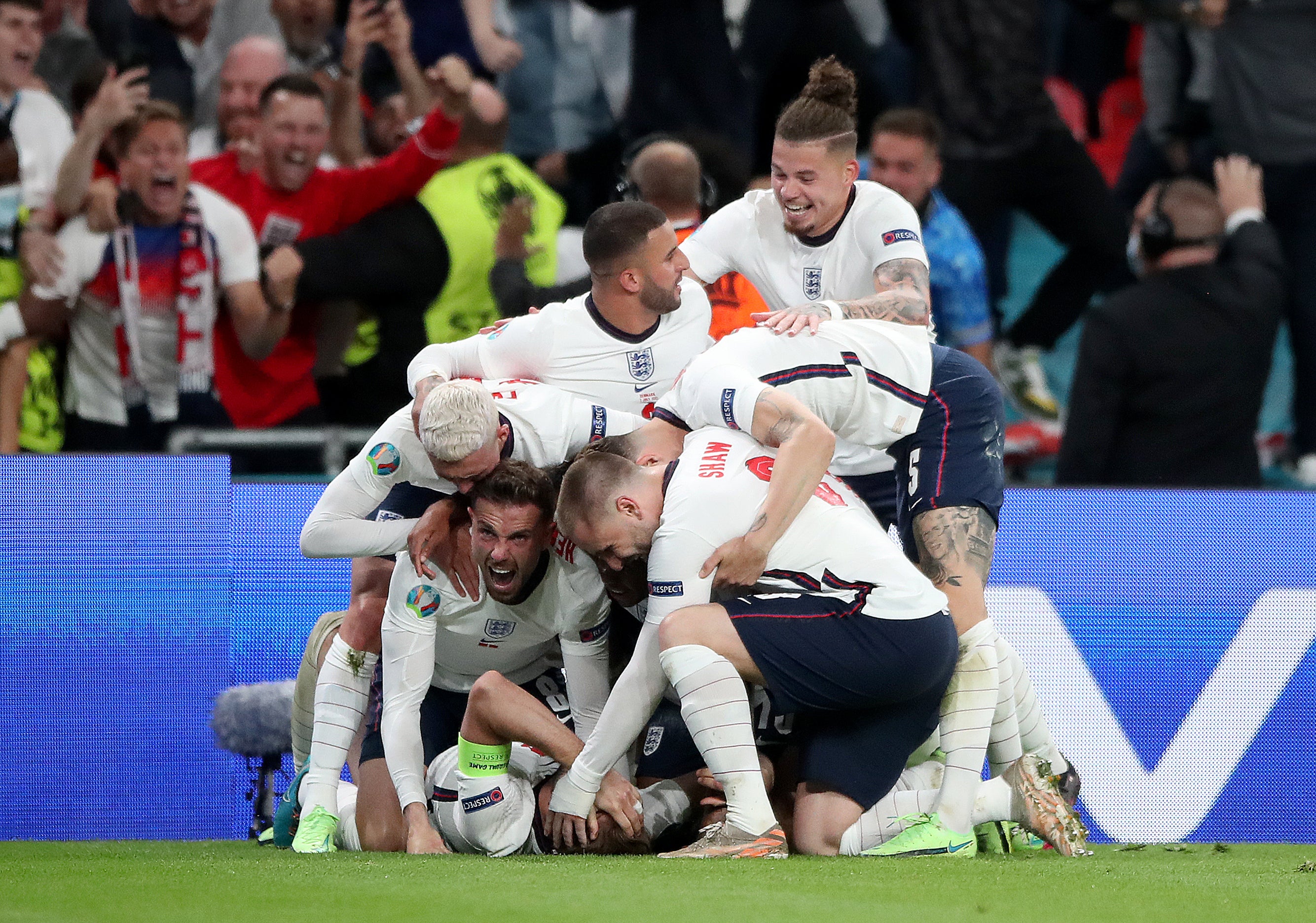 England’s Harry Kane is mobbed by team-mates after scoring the winner