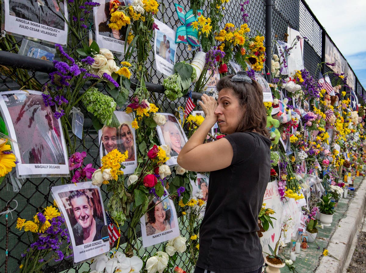 Families, rescuers hold vigil near collapsed building