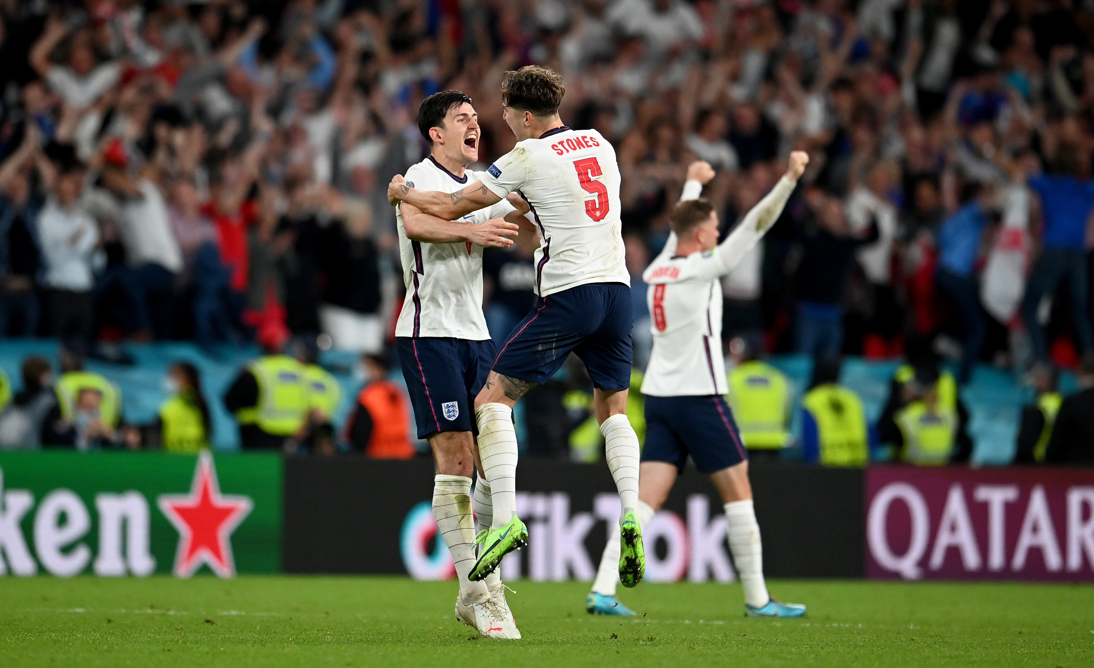 Rock steady: Maguire and his defensive partner John Stones celebrate at the final whistle on Wednesday