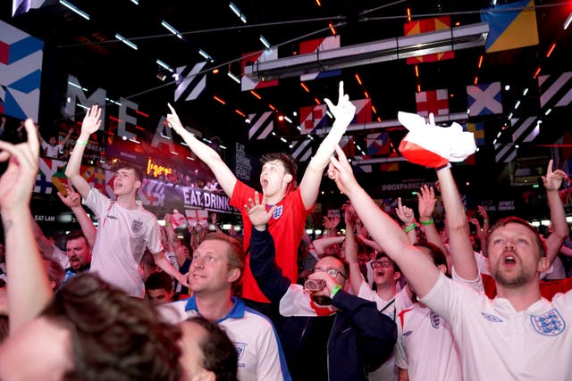 Fans celebrate England's win at the football
