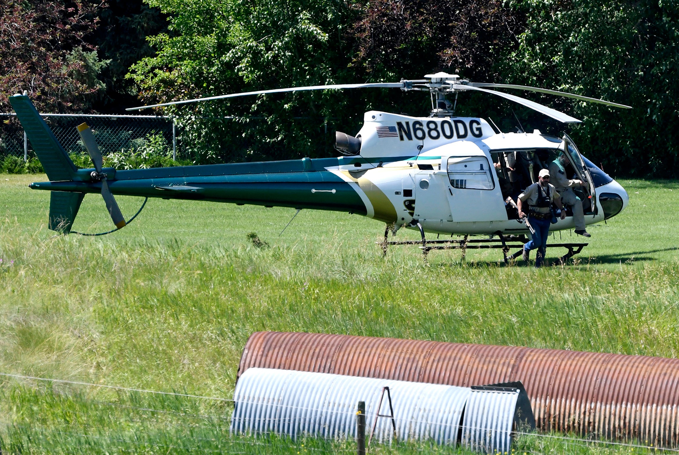 A Montana Department of Fish, Wildlife and Parks helicopter lands in Ovando, Montana, on Tuesday, 6 July 2021, after searching for a bear that killed a camper early that morning