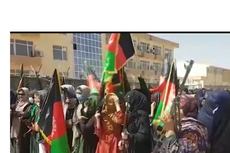 Gun-toting Afghan women are marching in the streets in a show of defiance against the Taliban