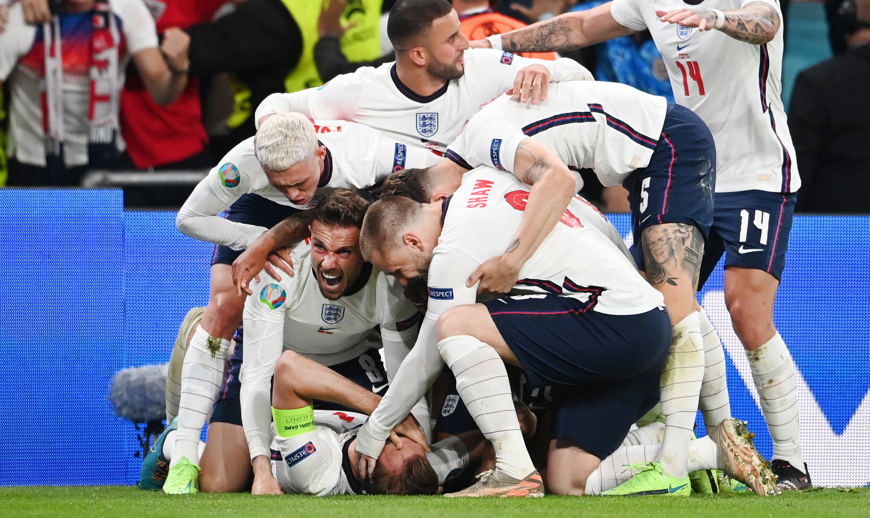 England’s players celebrate after captain Harry Kane scores