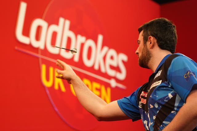 A player throws a dart at the Ladbrokes UK Open