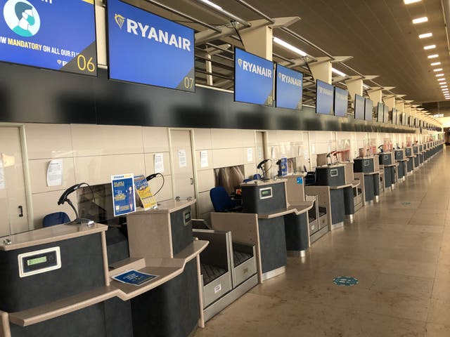 <p>Empty quarter: check in desks at Liverpool John Lennon Airport</p>