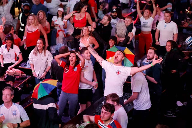 <p>England supporters celebrate England's penalty and second goal as they watch the UEFA EURO 2020 semi-final football match </p>
