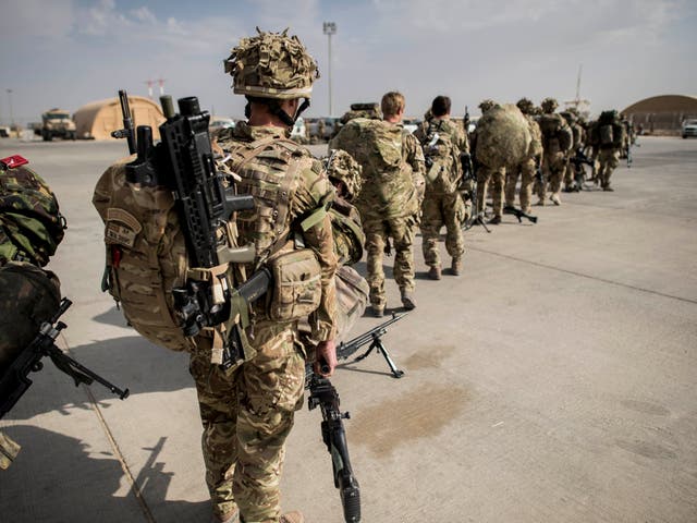 <p>British troops leaving Helmand province in 2014</p>