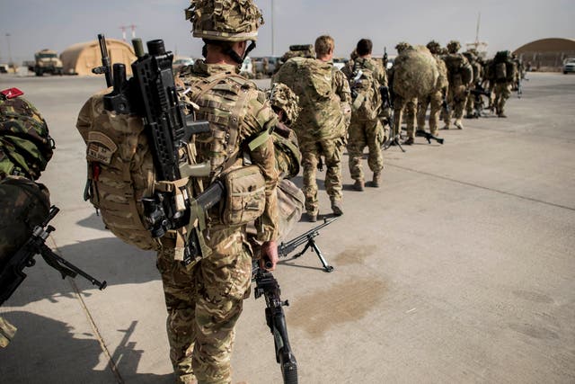 <p>British troops leaving Helmand province in 2014</p>