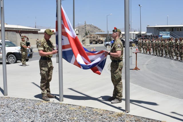 <p>Brigadier Oliver Brown, General Miller and the UK Ambassador attended a flag lowering ceremony in Afghanistan</p>