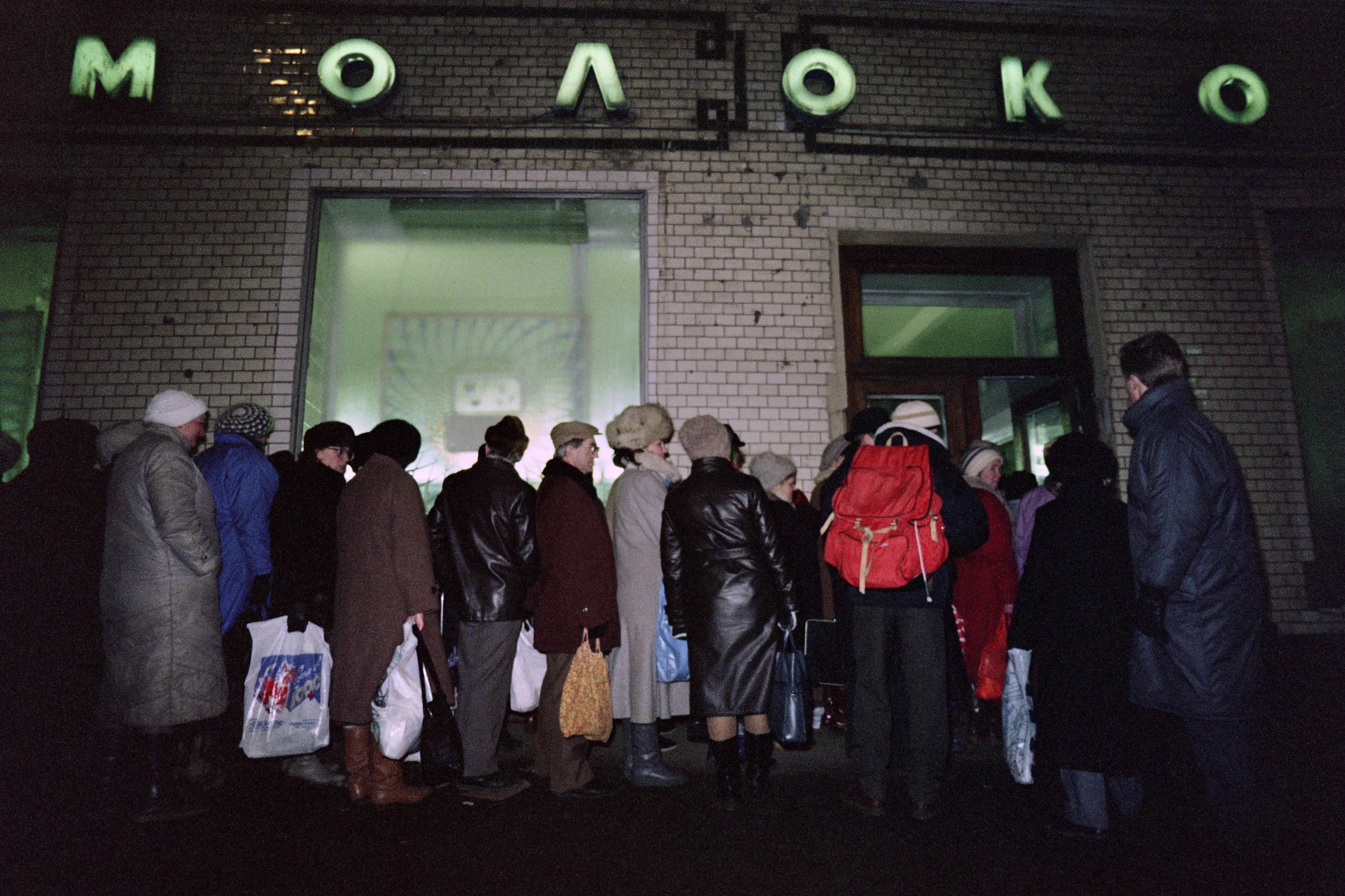 1990: Soviet citizens queue at Moloko store. The open market led to a tremendous economic and social crisis