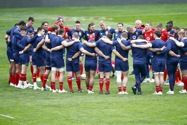 <p>Lions players in a huddle</p>