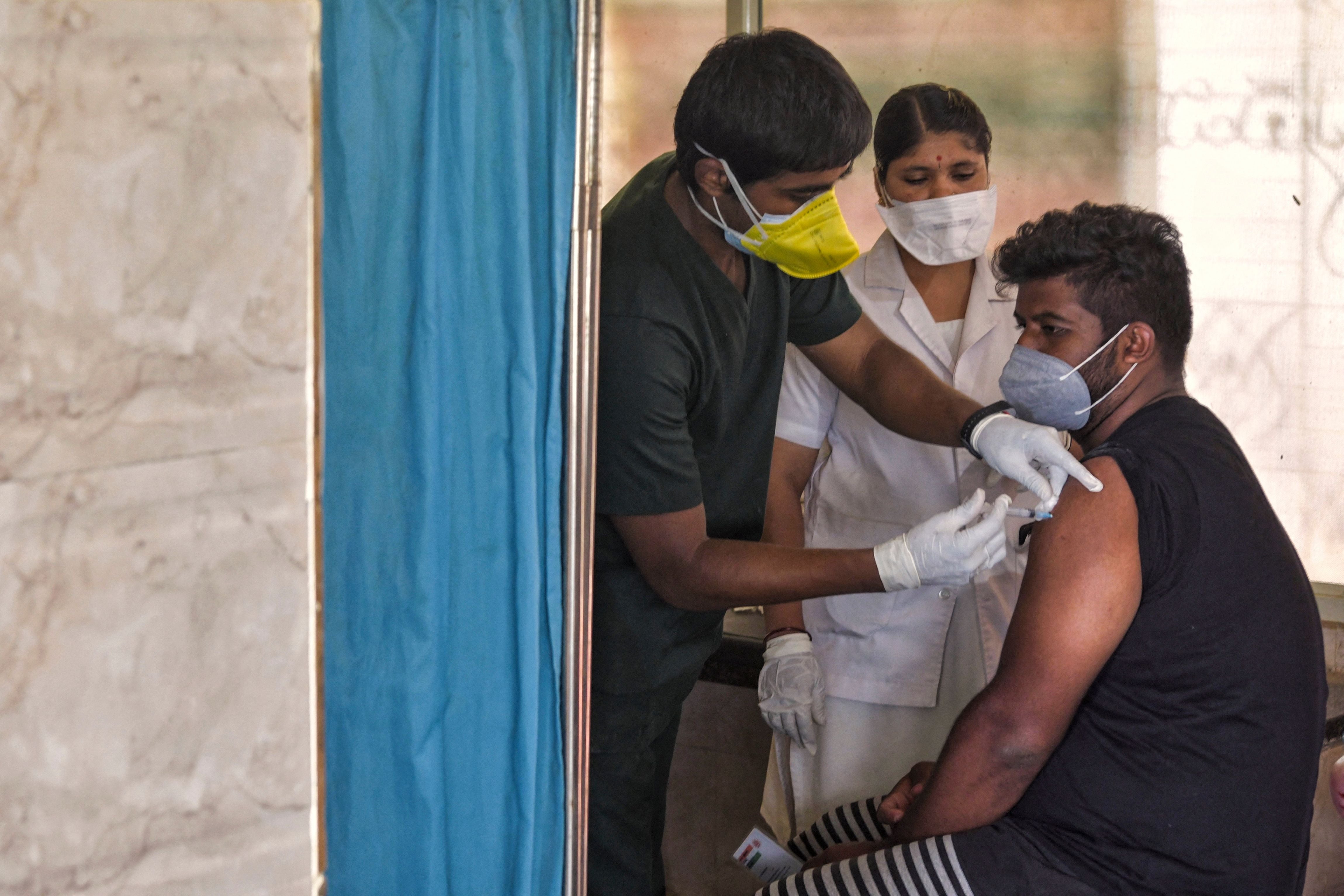 <p>A health worker inoculates a person with a dose of Covid-19 vaccine at a public health centre in India’s Bengaluru on 7 July, 2021</p>