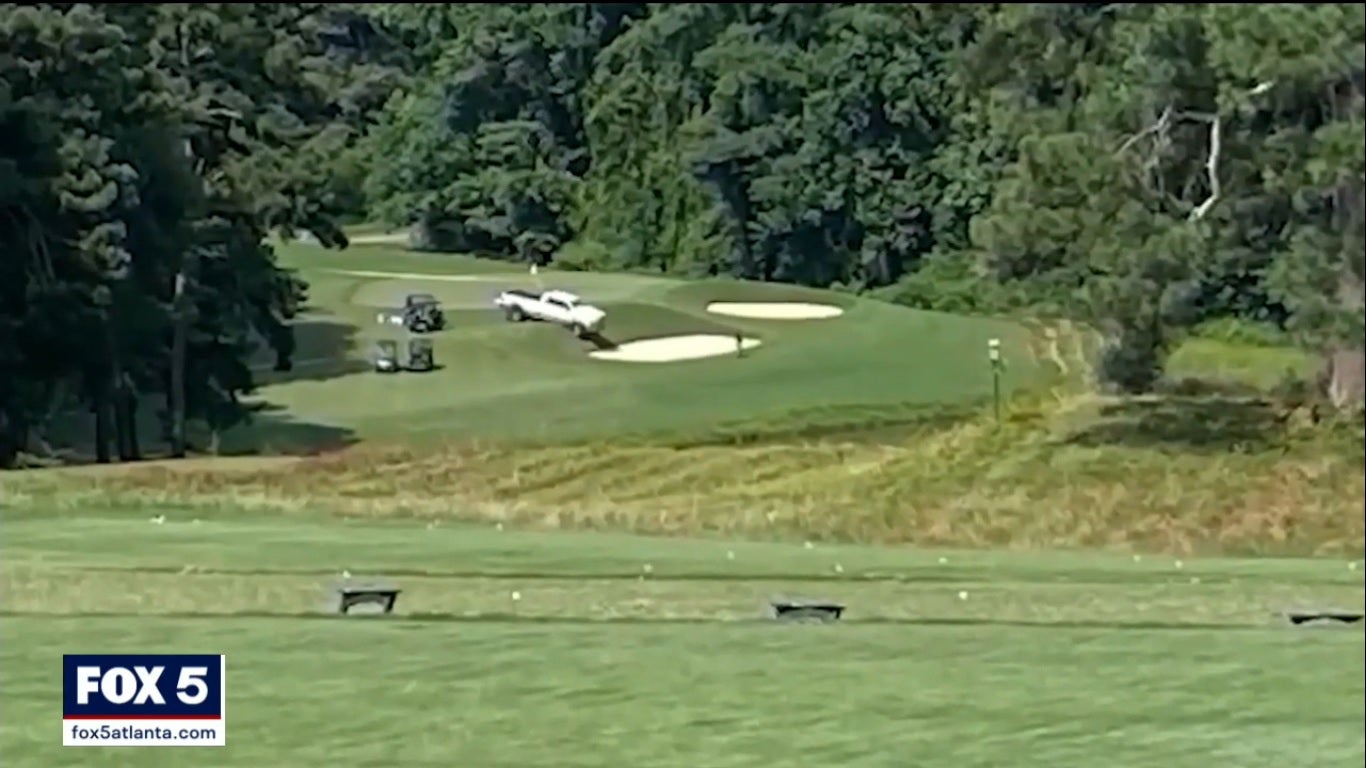 The white pickup truck on the tenth hole at Pinetree Country Club golf course in Georgia, where three bodies were found on 3 July 2021.