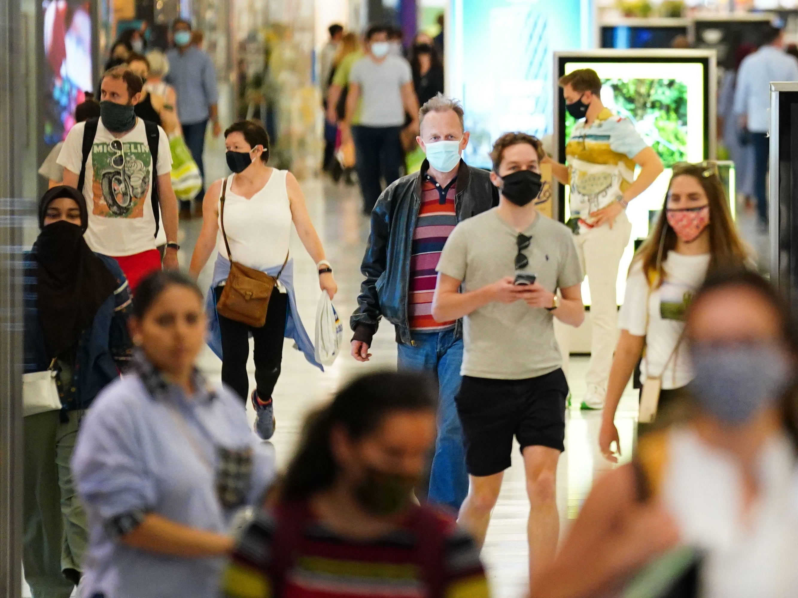 Shoppers wearing facemasks inside a shopping centre in East London