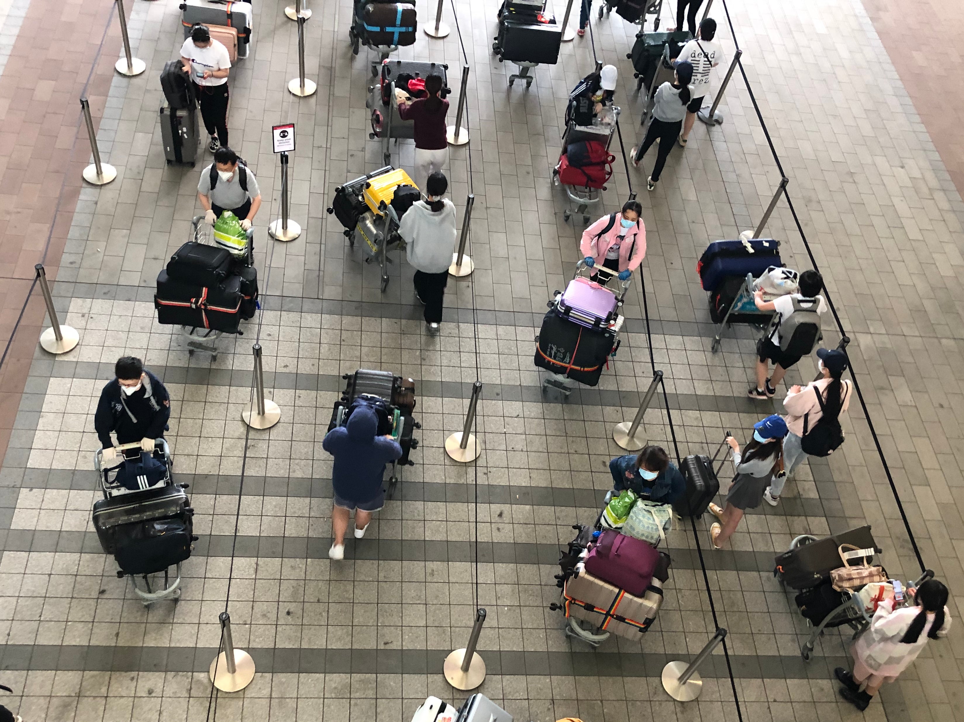 Waiting game: passengers at Heathrow airport Terminal 2