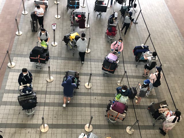 <p>Waiting game: passengers at Heathrow airport Terminal 2</p>