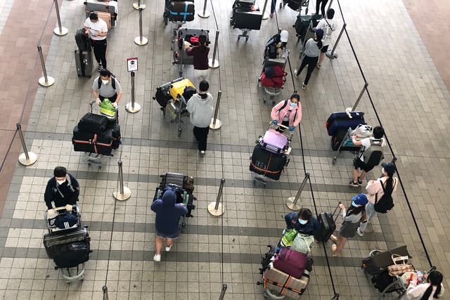 <p>Waiting game: passengers at Heathrow airport Terminal 2</p>