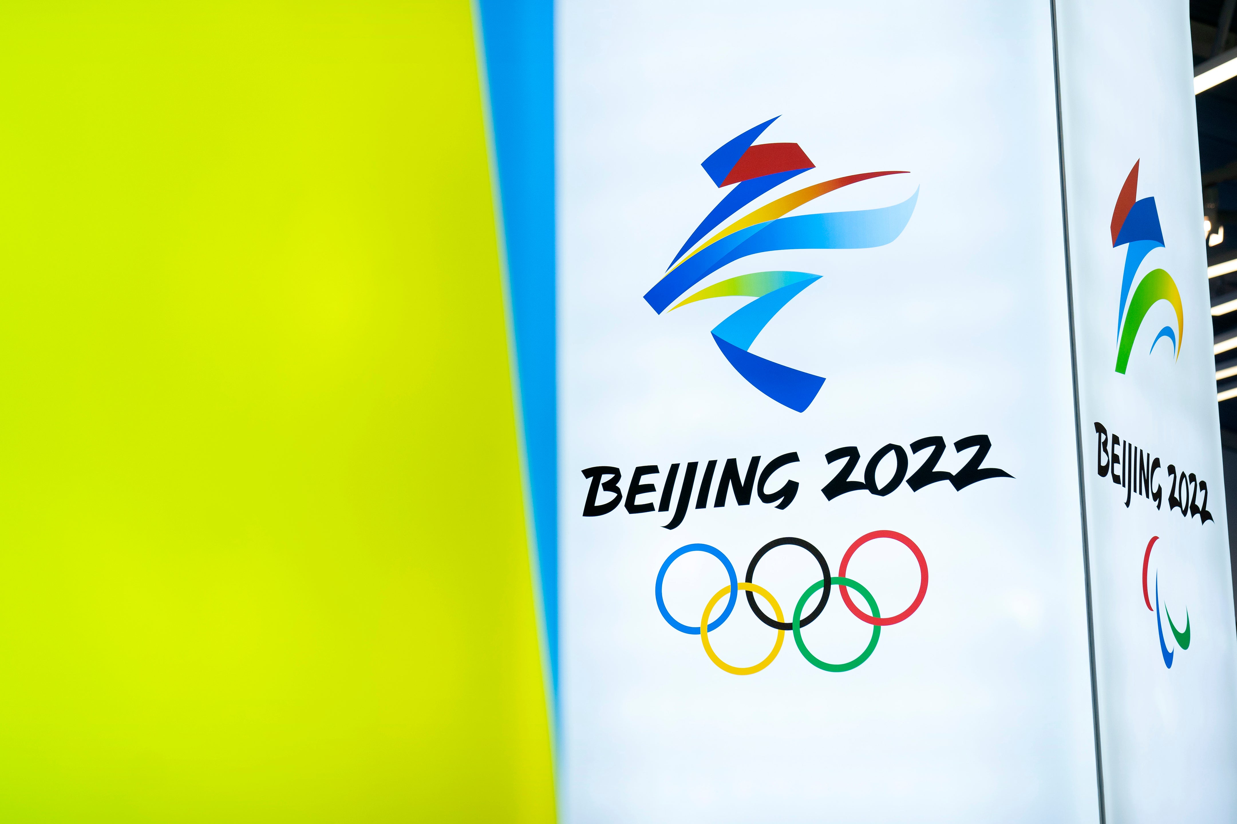 In this 5 Feb, 2021, file photo, the logos for the 2022 Beijing Winter Olympics and Paralympics are seen during an exhibit at a visitors center at the Winter Olympic venues in Yanqing on the outskirts of Beijing