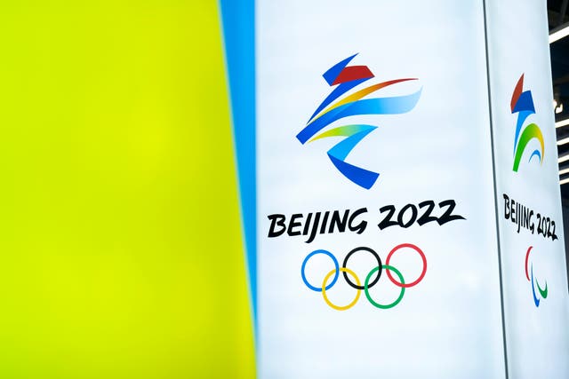 <p>In this 5 Feb, 2021, file photo, the logos for the 2022 Beijing Winter Olympics and Paralympics are seen during an exhibit at a visitors center at the Winter Olympic venues in Yanqing on the outskirts of Beijing</p>