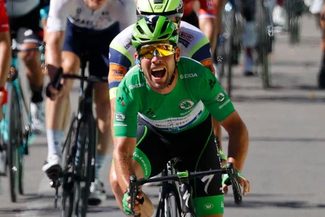 <p>Mark Cavendish crosses the line as he wins stage 13</p>