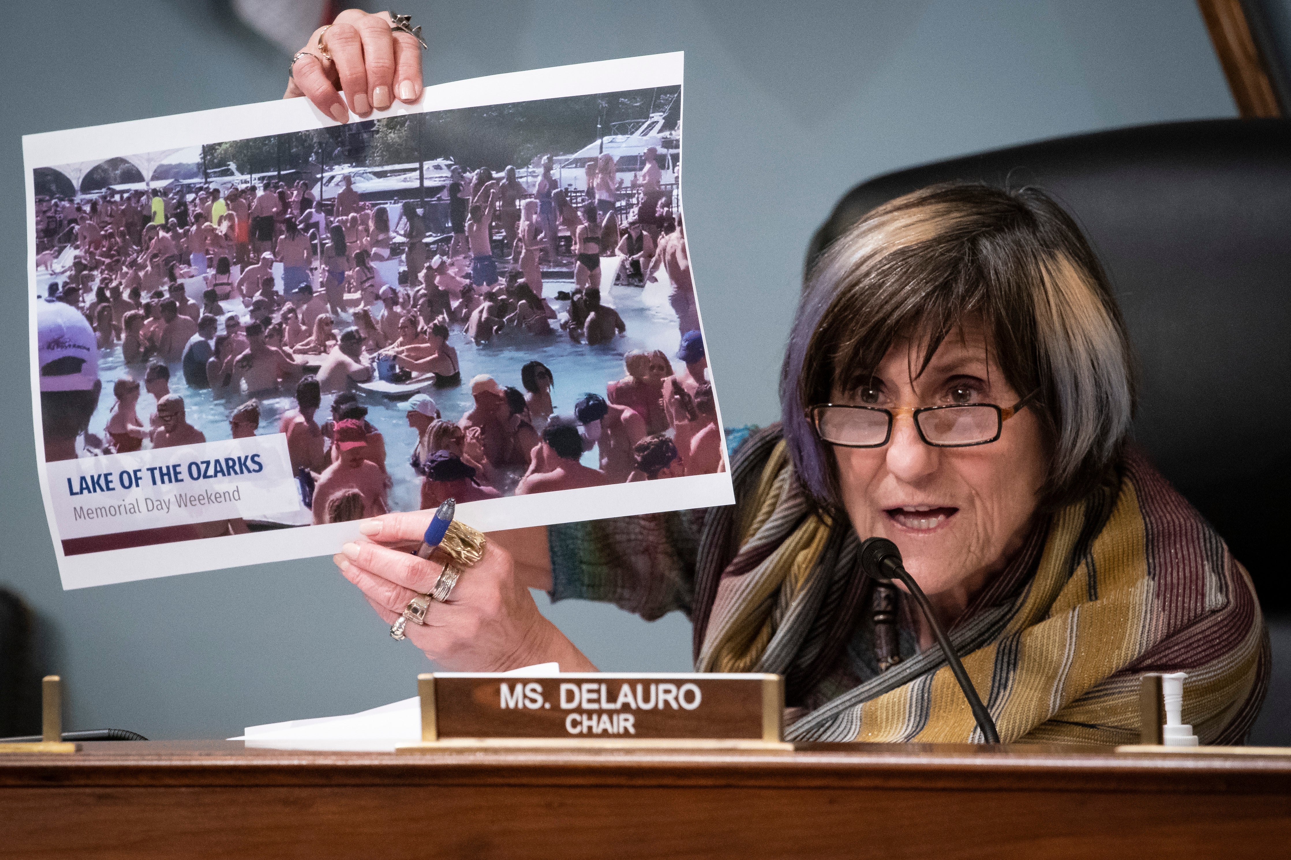 Representative Rosa DeLauro, a Democrat from Connecticut and chairwoman of the House Appropriations Subcommittee on Labor, Health and Human Services, Education, and Related Agencies, holds a photograph from the Lake of the Ozarks in Missouri on Memorial Day Weekend, during a hearing on Capitol Hill in Washington, D.C., U.S., on Thursday, June 4, 2020.