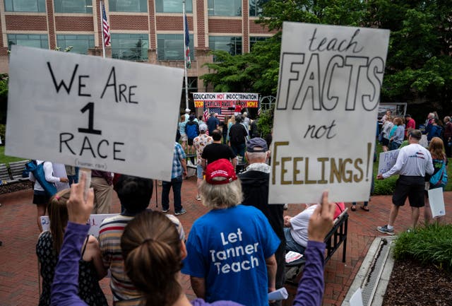 <p>Protesters gather in Virginia on June 12, 2021, to protest critical race theory. Congressman Mark Green has called for an Air Force Academy professor to be fired for teaching CRT to students</p>